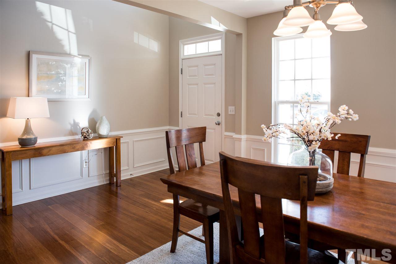 7725 Jackson Dane Drive Raleigh, NC 27613 - Photo 2 of 24 a view of a dining room with furniture window and wooden floor