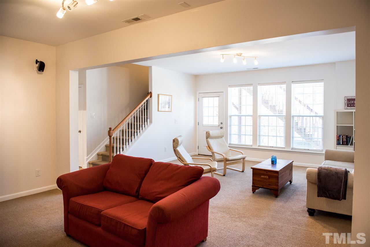 7725 Jackson Dane Drive Raleigh, NC 27613 - Photo 19 of 24 a living room with furniture and a window