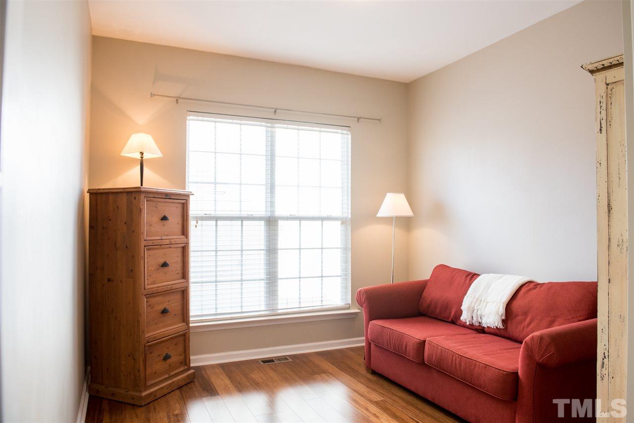 7725 Jackson Dane Drive Raleigh, NC 27613 - Photo 8 of 24 a living room with furniture and a window
