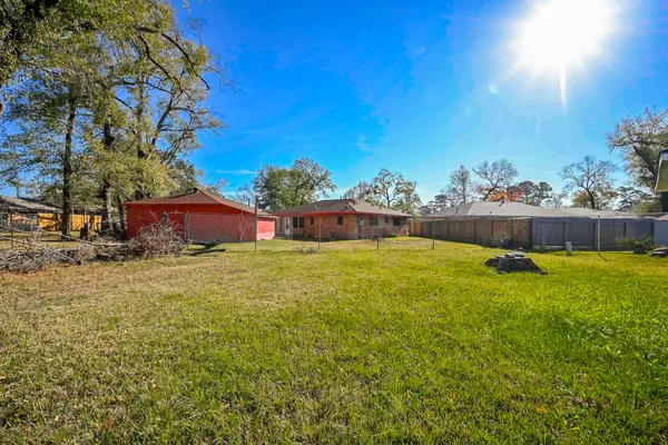 a swimming pool with outdoor seating and yard