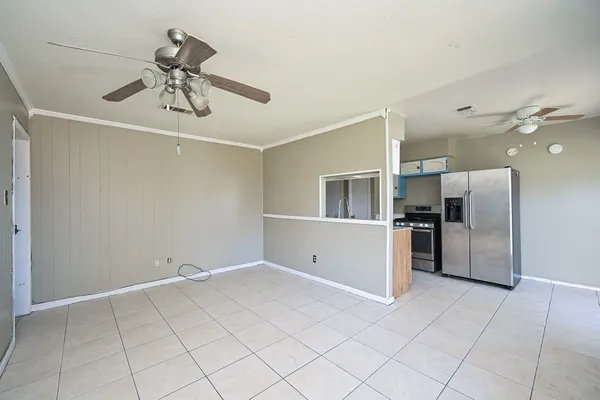 a view of a kitchen with a sink and refrigerator