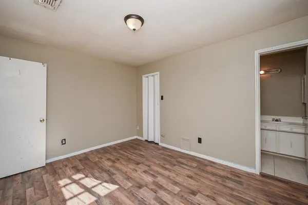 a view of a room with wooden floor and sink
