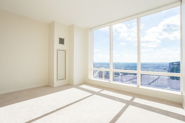 a view of a bedroom with a large window