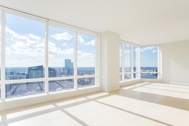a view of a room with a large window