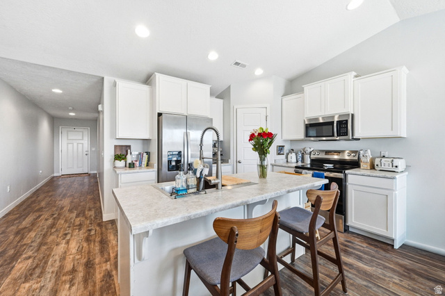 1175 Silver Hollow Road Syracuse, UT 84075 - Photo 13 of 34 Modern kitchen featuring white shaker cabinetry and stainless steel appliances
