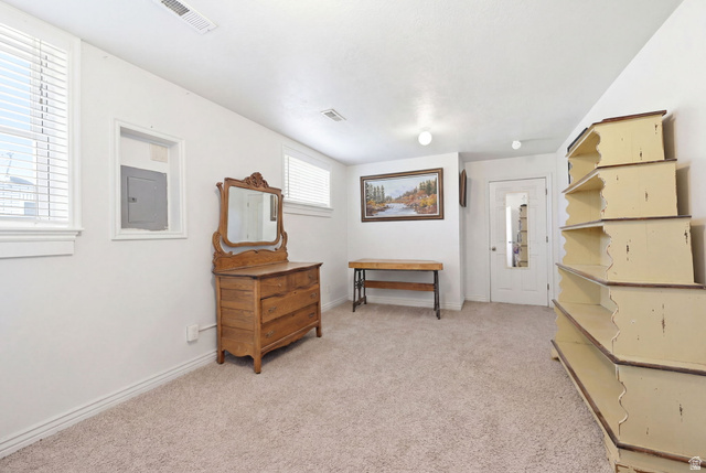 310 South 300 West Payson, UT 84651 - Photo 26 of 42 Carpeted room with white walls, two windows featuring blinds, and a built-in recessed electrical panel