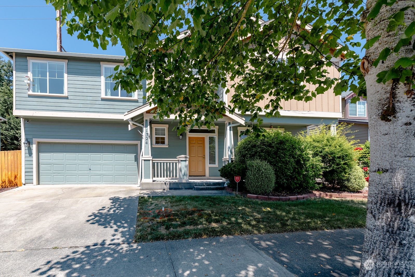 front view of a house with a yard
