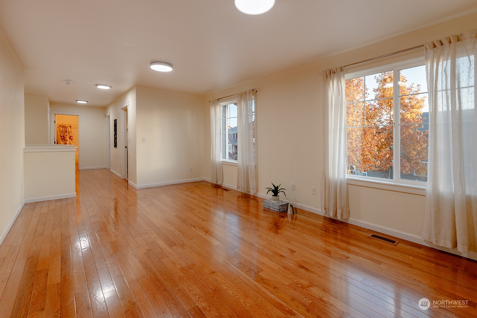 1324 Farina Loop Southeast Olympia, WA 98513 - Photo 16 of 40 a view of empty room with wooden floor and fan