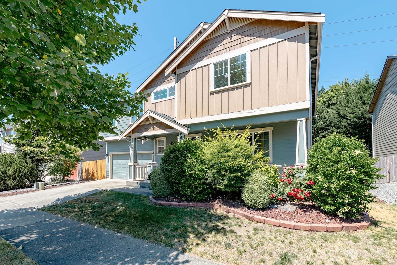 1324 Farina Loop Southeast Olympia, WA 98513 - Photo 2 of 40 a front view of a house with a yard