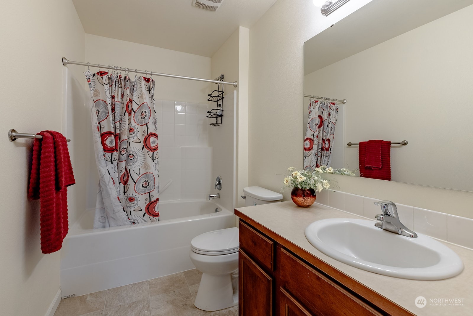 1324 Farina Loop Southeast Olympia, WA 98513 - Photo 21 of 40 a bathroom with a sink toilet and shower curtain