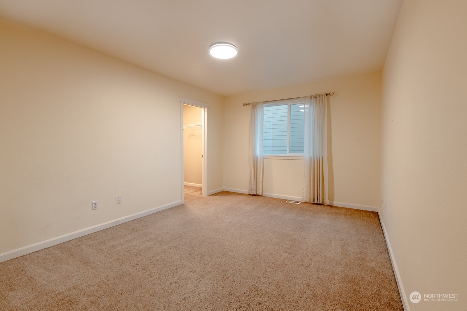 1324 Farina Loop Southeast Olympia, WA 98513 - Photo 22 of 40 an empty room with windows and closet