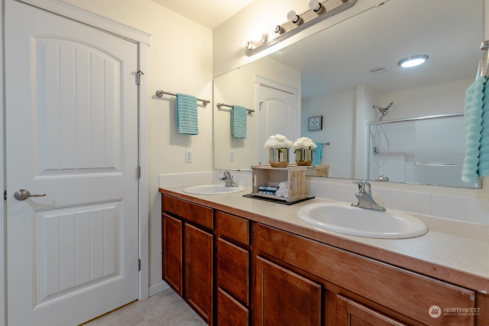 1324 Farina Loop Southeast Olympia, WA 98513 - Photo 28 of 40 a bathroom with a sink double vanity and a mirror
