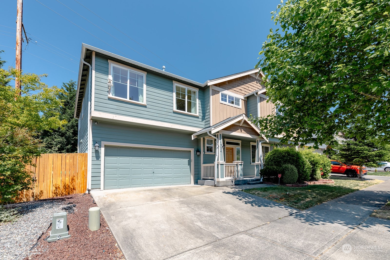 1324 Farina Loop Southeast Olympia, WA 98513 - Photo 3 of 40 a front view of a house with a yard and garage