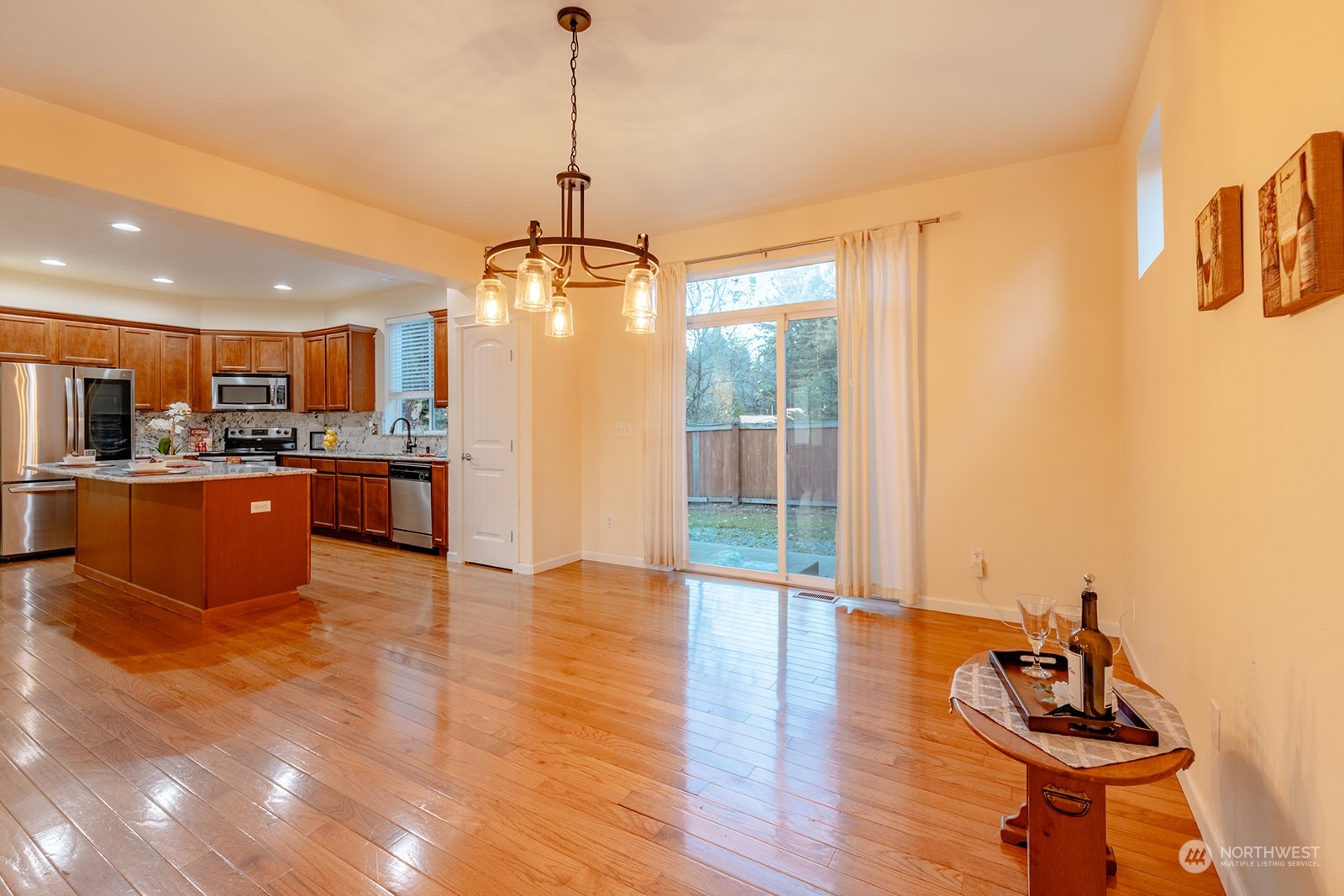1324 Farina Loop Southeast Olympia, WA 98513 - Photo 7 of 40 a view of a living room and kitchen with stainless steel appliances