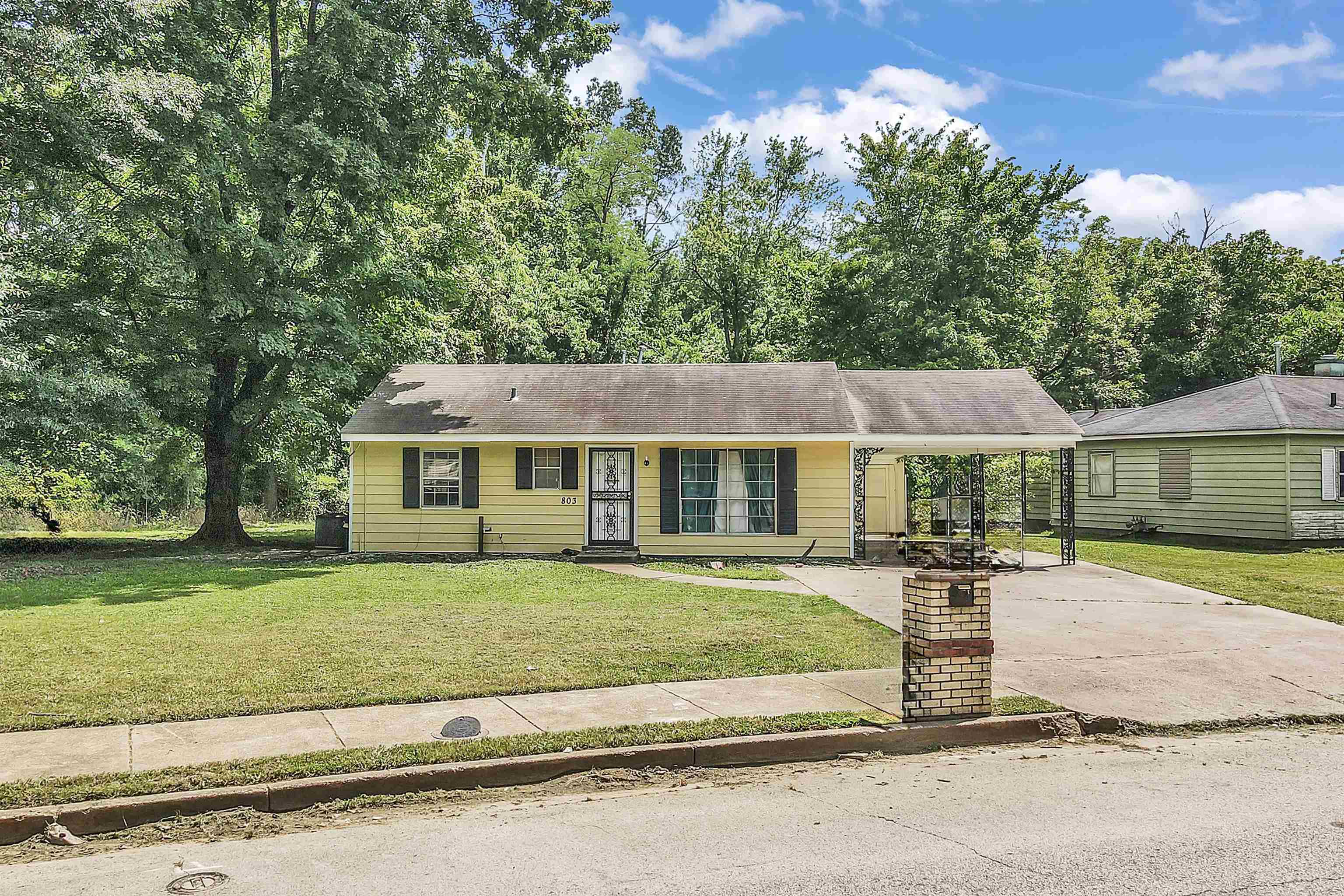 front view of a house with a patio