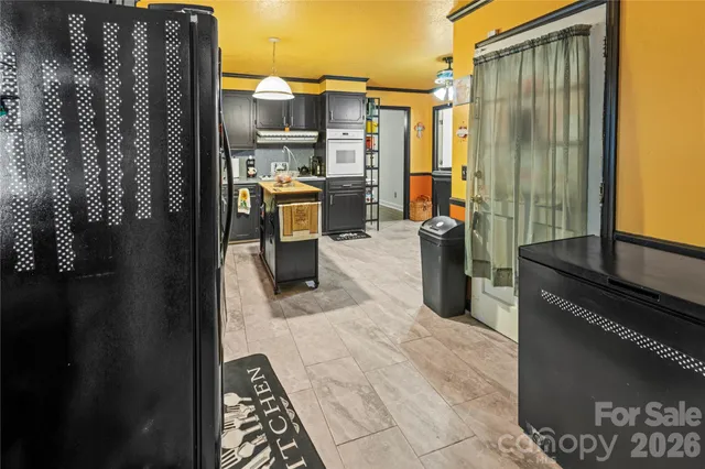 a view of a kitchen with a refrigerator and dishwasher