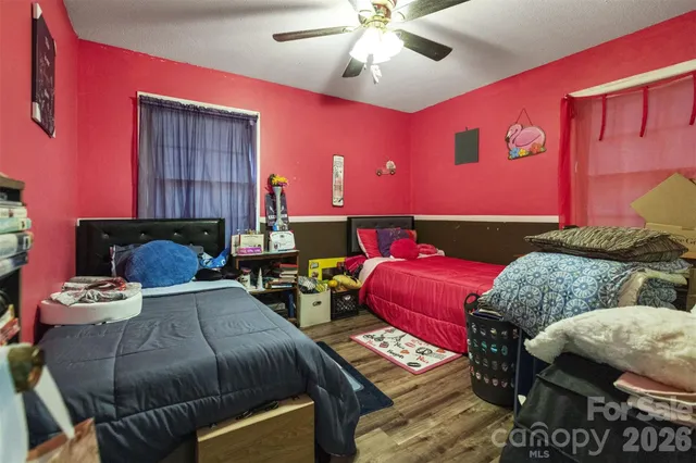 a living room with furniture and a lamp