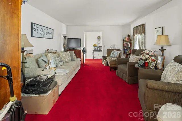 a living room with furniture window and a lamp