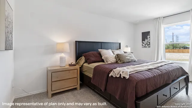 a bedroom with a bed and a mirror