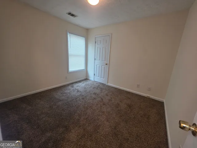 en empty room with windows