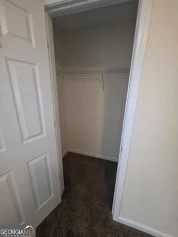 an empty room with a empty space and window