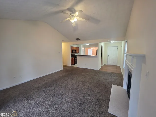 a view of livingroom with furniture and chandelier fan