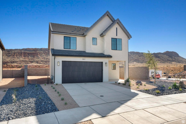 1556 Fins Road, Unit 4147 Washington, UT 84780 - Photo 1 of 1 Modern inspired farmhouse with a mountain view, an attached garage, driveway, and stucco siding