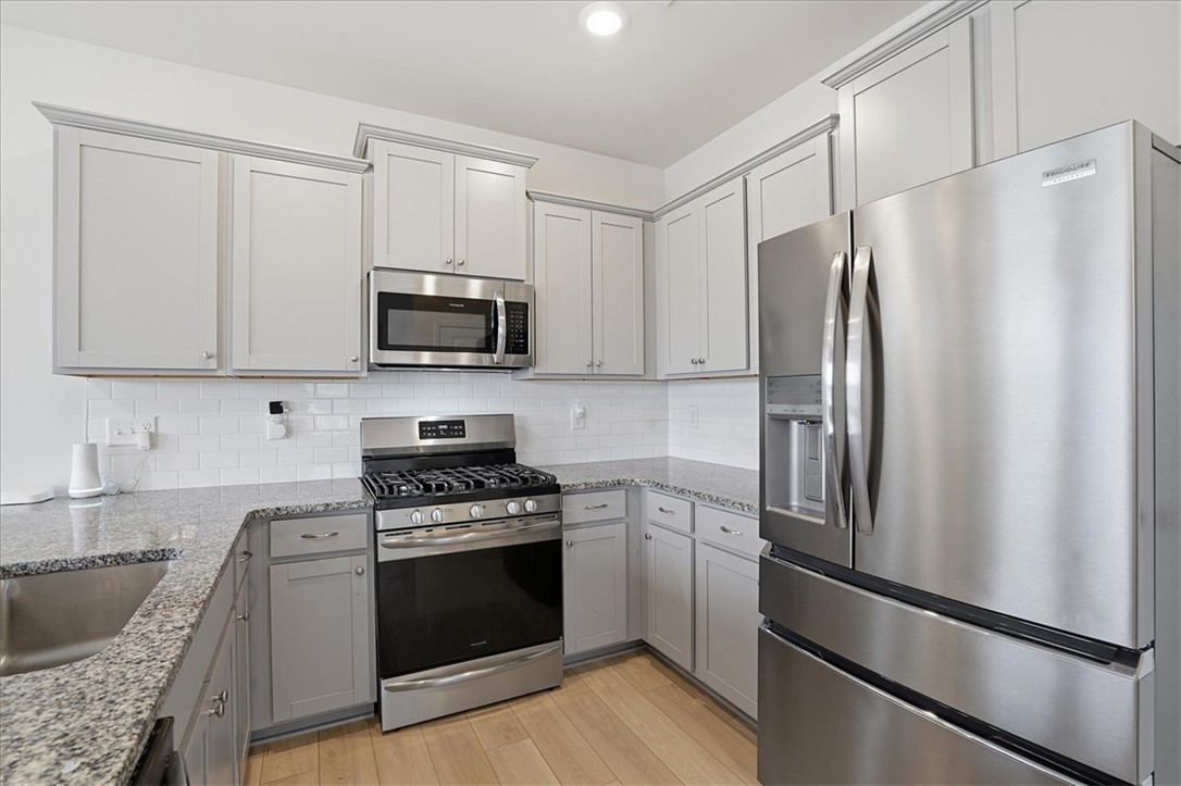 365 Sliding Rock Drive Pendleton, SC 29670 - Photo 14 of 46 Culinary delights await in this light-filled kitchen, boasting ample counter space and modern appliances.