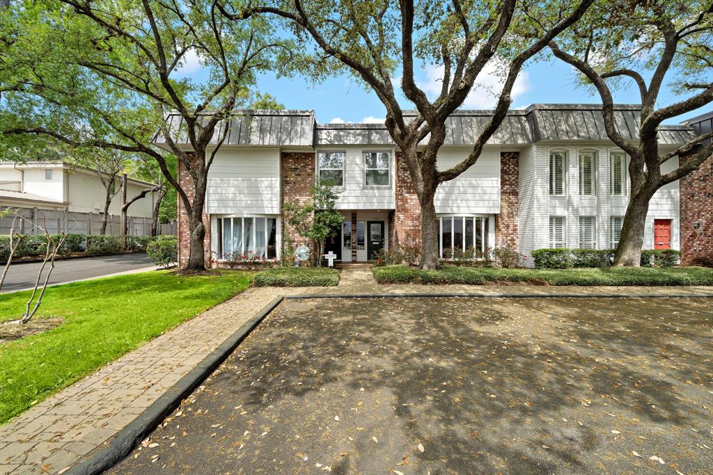 8954 Chatsworth Drive Houston, TX 77024 - Photo 1 of 45 a view of a large trees in front of a house