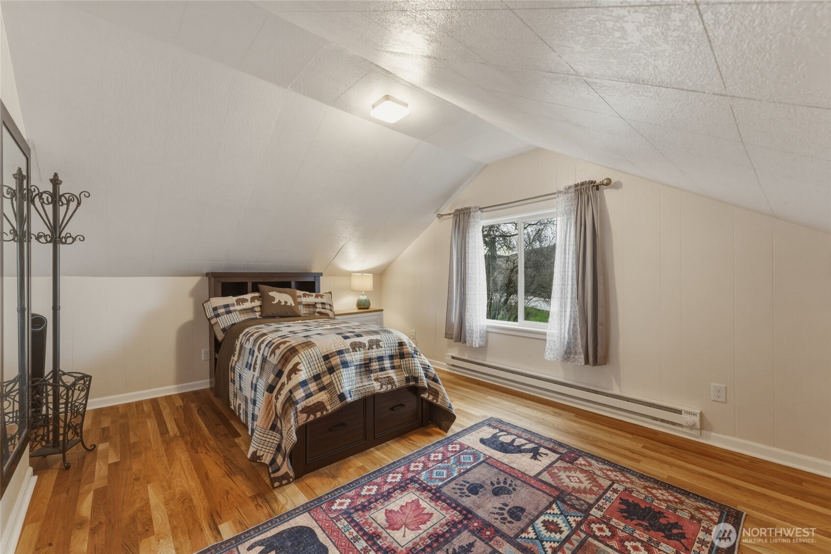 315 Thorn Hollow Road Dayton, WA 99328 - Photo 24 of 40 a bed sitting in a bedroom next to a window