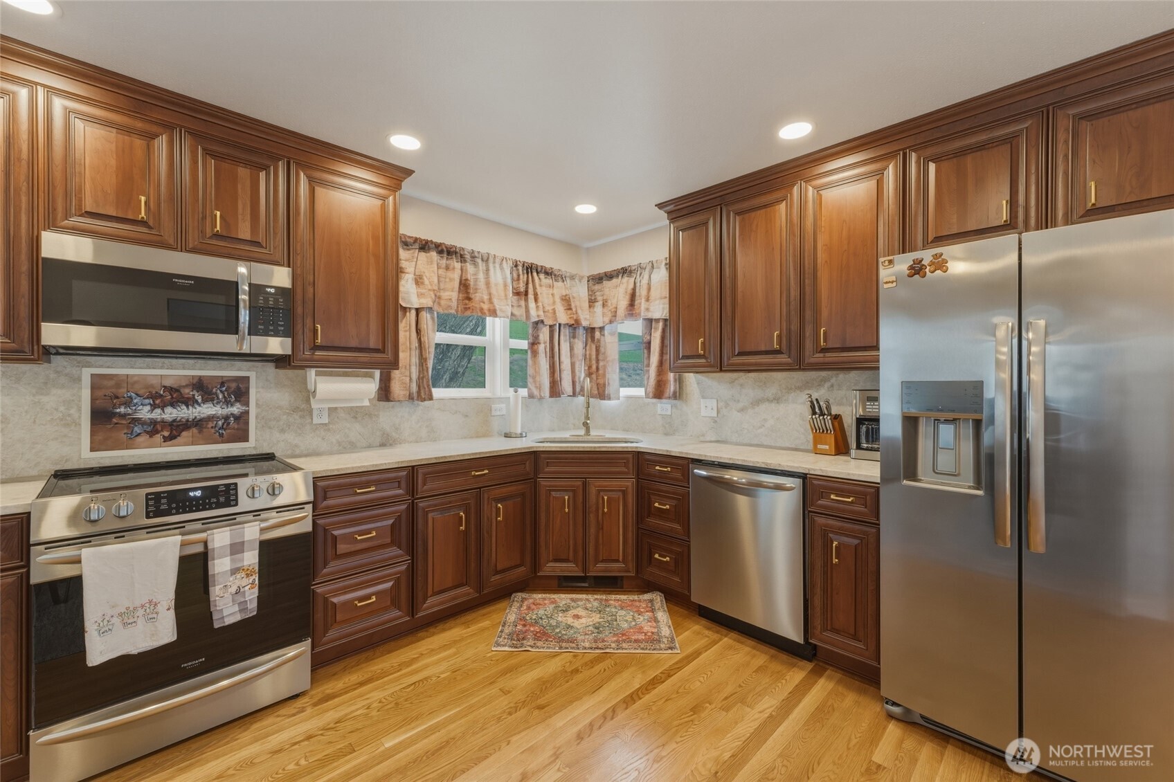 315 Thorn Hollow Road Dayton, WA 99328 - Photo 8 of 40 a kitchen with stainless steel appliances granite countertop a stove sink microwave and refrigerator