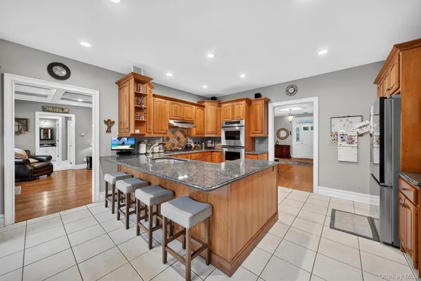 a lobby with furniture and floor to ceiling window