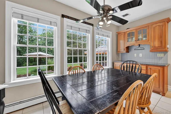 a view of a dining room with furniture window and outside view
