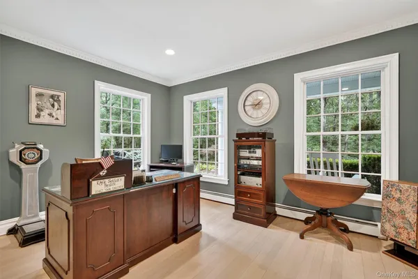 a work room with furniture and windows