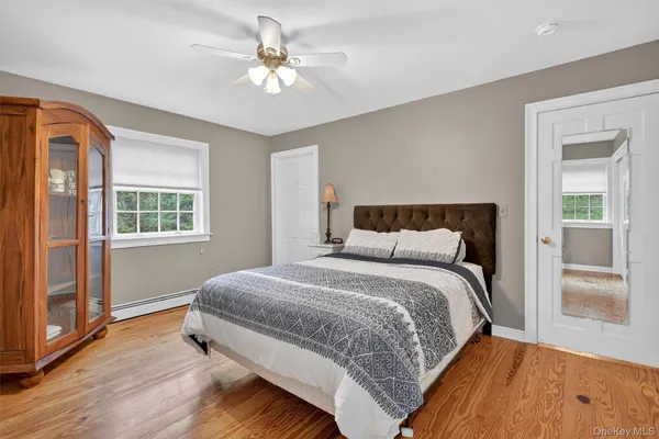 a bedroom with a large bed and a window
