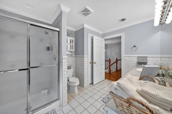 a bedroom with a bed and a shower