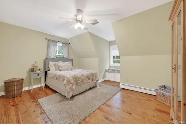 a bedroom with a bed and lamps