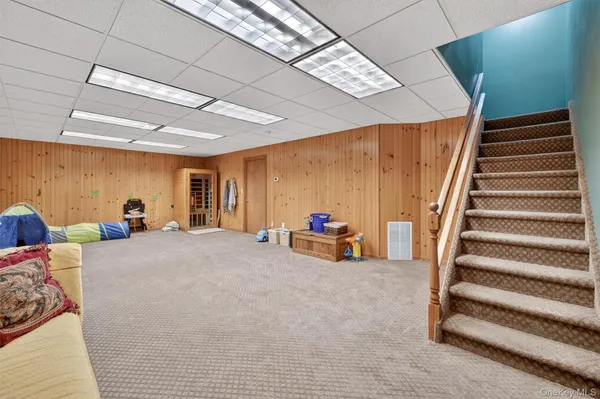 a bed room with furniture and a chandelier
