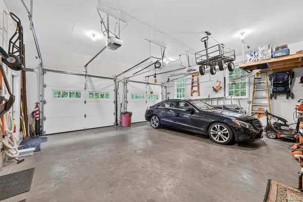 a view of parking garage with cars parked