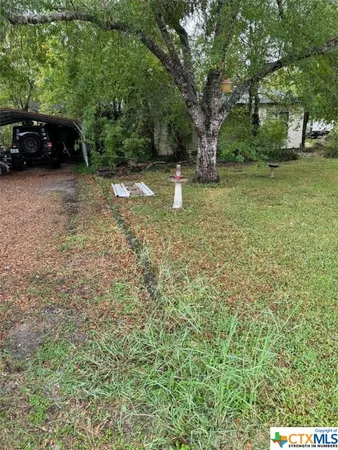 a view of backyard with outdoor space