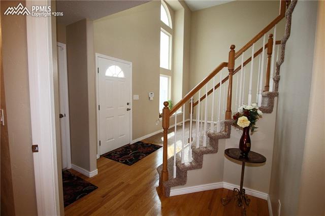 5224 Rondo Way Colorado Springs, CO 80911 - Photo 3 of 36 Beautiful entry with 2-story windows.