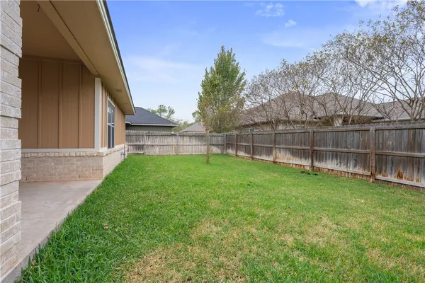 a view of a backyard with a garden