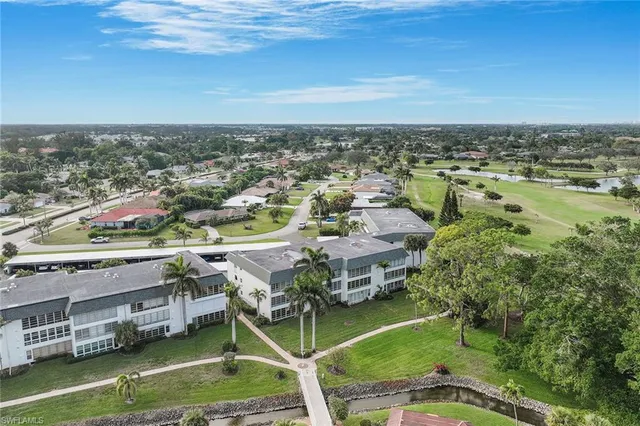 an aerial view of a golf course with swimming pool