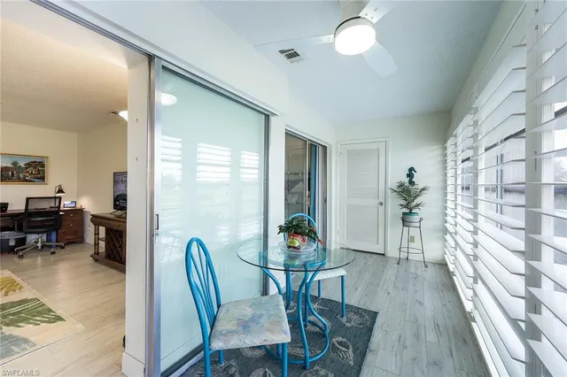 a view of a livingroom with furniture and a potted plant