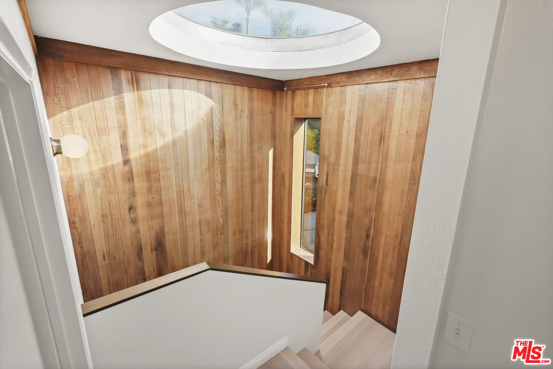 2909 Searidge Street Malibu, CA 90265 - Photo 22 of 29 a view of a room with a wooden floor and a window