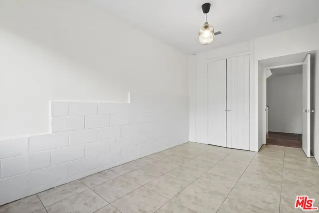 an aerial view of a house with a garden