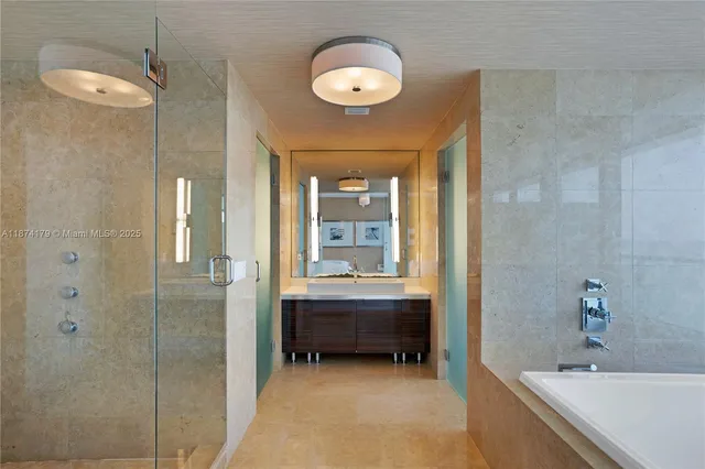 a bathroom with a tub and a shower
