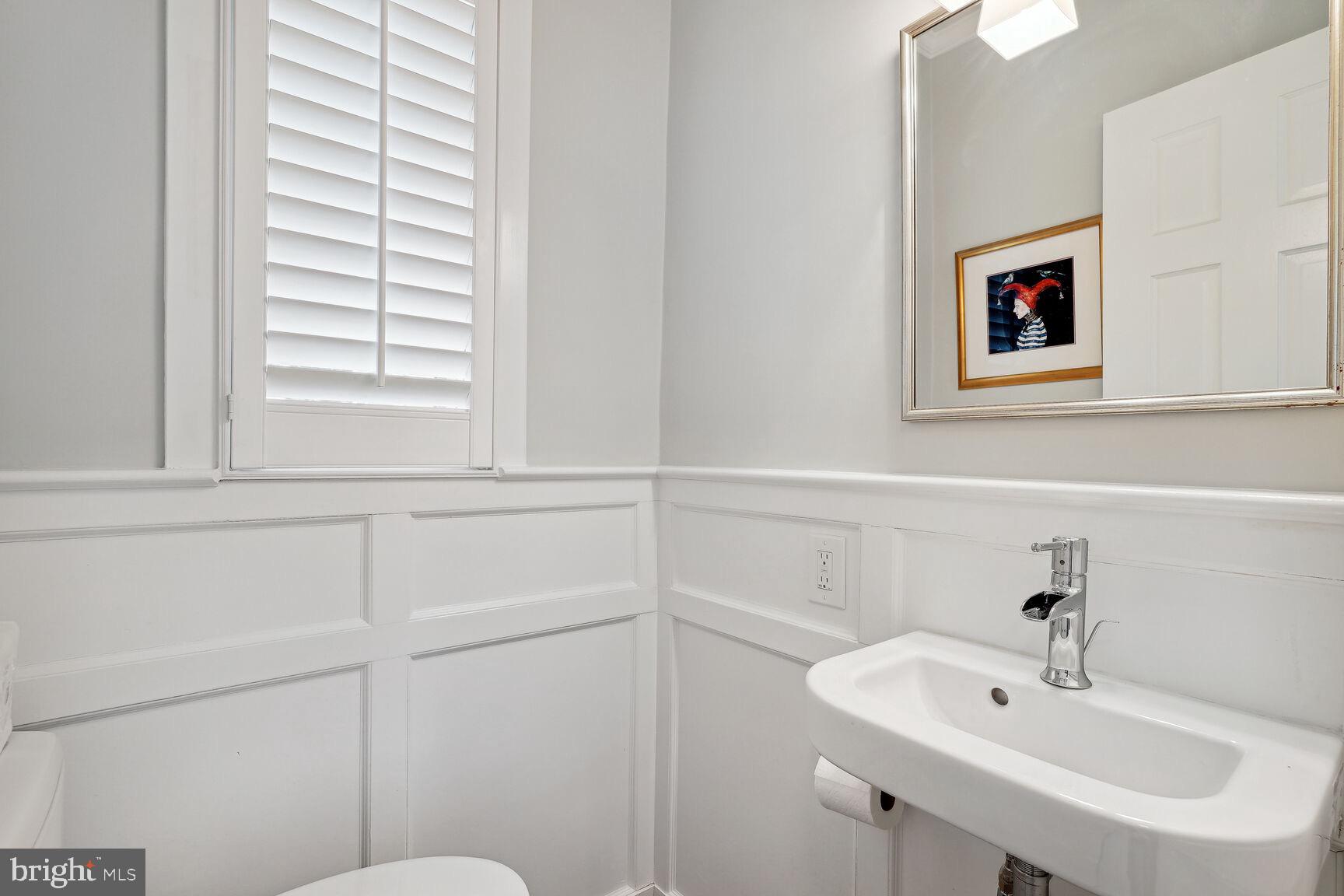 8105 Rayburn Road Bethesda, MD 20817 - Photo 14 of 25 Main level powder room with gorgeous moldings