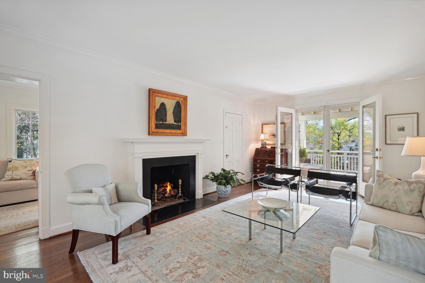 8105 Rayburn Road Bethesda, MD 20817 - Photo 3 of 25 Light filled lr w/ gas fp & french drs to porch