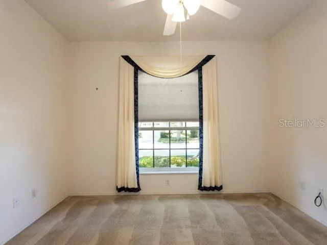 an empty room with sliding glass door